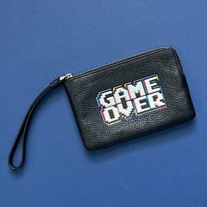 COACH "Game Over" Pac-Man corner zip pebbled leather wristlet